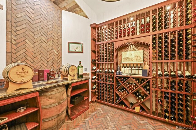 1287 Buffalo Ridge Rd, Castle Pines, CO 80108 - wine cellar featuring brick flooring