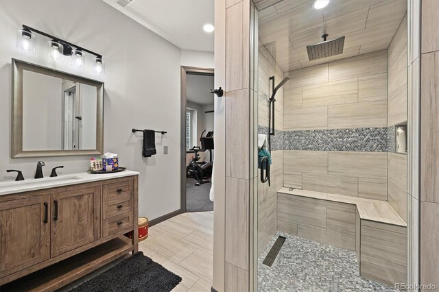 1287 Buffalo Ridge Rd, Castle Pines, CO 80108 - bathroom featuring a shower stall, vanity, baseboards, recessed lighting, and tile patterned floors