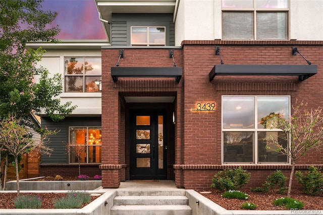 3439 Uinta St, Denver, CO 80238 - view of exterior entry featuring brick siding and stucco siding