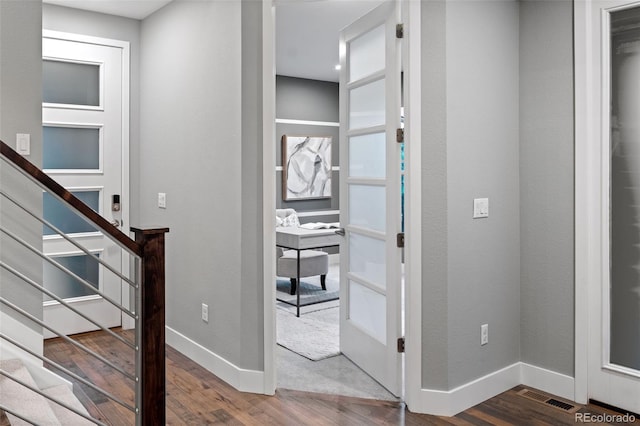 3439 Uinta St, Denver, CO 80238 - hallway featuring wood finished floors, baseboards, and stairs