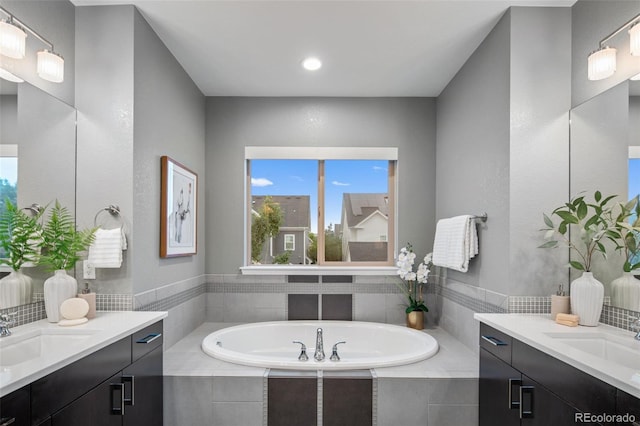 3439 Uinta St, Denver, CO 80238 - bathroom with two vanities, a bath, and recessed lighting