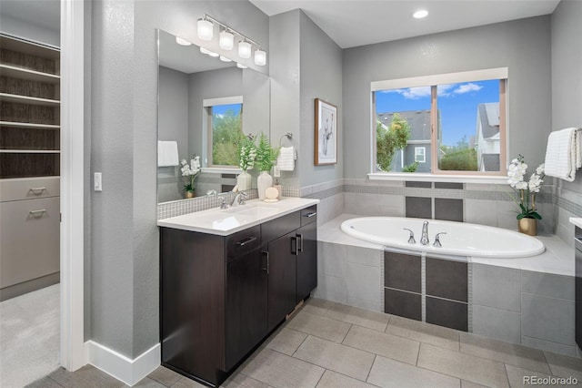 3439 Uinta St, Denver, CO 80238 - full bathroom featuring vanity, a bath, plenty of natural light, recessed lighting, and tile patterned floors