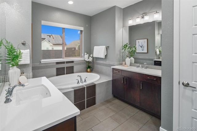 3439 Uinta St, Denver, CO 80238 - bathroom with two vanities, a garden tub, tile patterned floors, and recessed lighting
