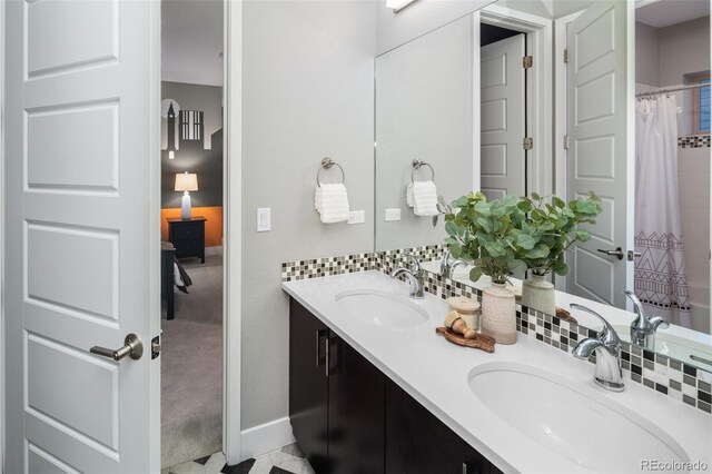 3439 Uinta St, Denver, CO 80238 - bathroom featuring double vanity and baseboards