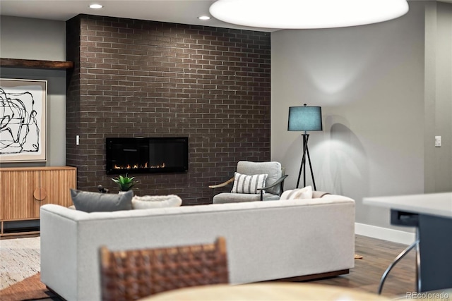 3439 Uinta St, Denver, CO 80238 - living area featuring a fireplace, wood finished floors, baseboards, and recessed lighting