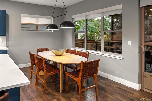 3439 Uinta St, Denver, CO 80238 - dining area featuring baseboards and dark wood finished floors