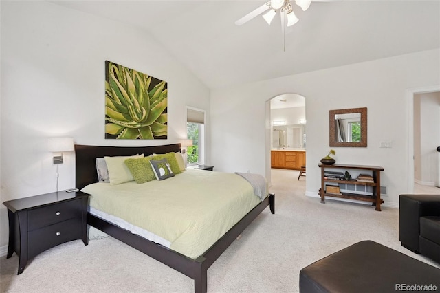 3144 Stevens Cir N, Erie, CO 80516 - bedroom featuring arched walkways, vaulted ceiling, light colored carpet, ensuite bathroom, and ceiling fan