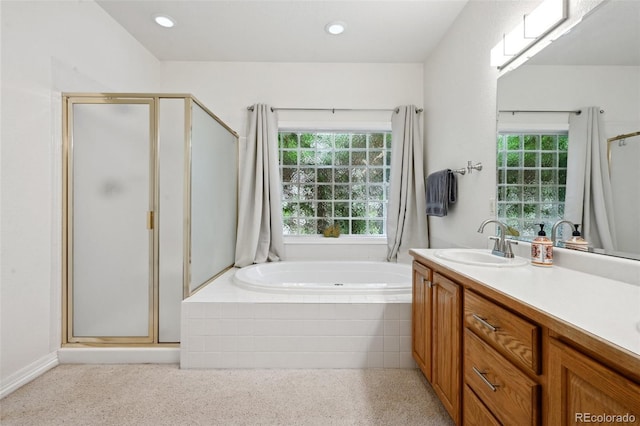 3144 Stevens Cir N, Erie, CO 80516 - bathroom with a stall shower, plenty of natural light, a garden tub, and recessed lighting
