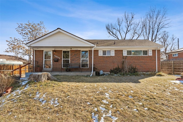 back of house featuring a yard