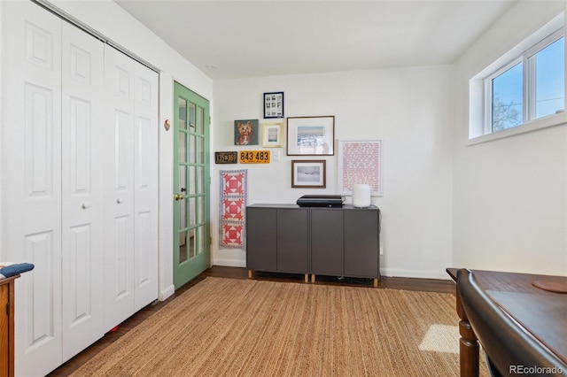 entrance foyer with wood finished floors and baseboards