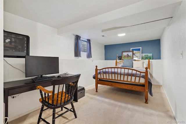 bedroom with baseboards and carpet