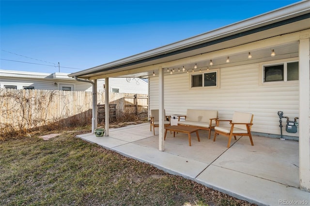 view of patio / terrace featuring fence