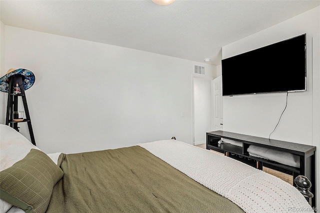 bedroom featuring visible vents