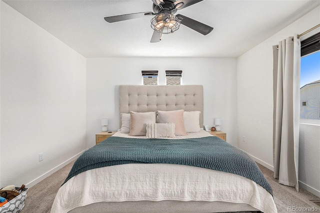 bedroom featuring ceiling fan, carpet floors, and baseboards