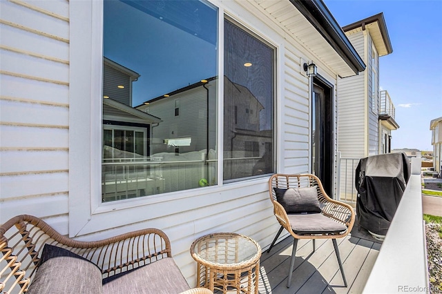 wooden deck with area for grilling