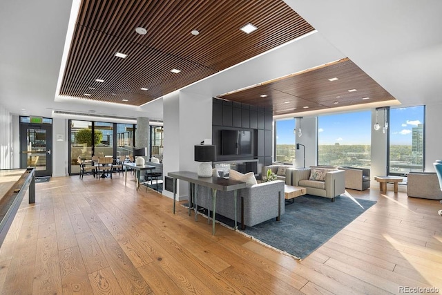 living room with wood-type flooring and recessed lighting