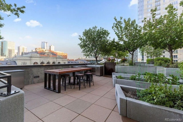 1750 Wewatta St Unit 830, Denver, CO 80202 - view of patio / terrace featuring an outdoor bar and a view of city