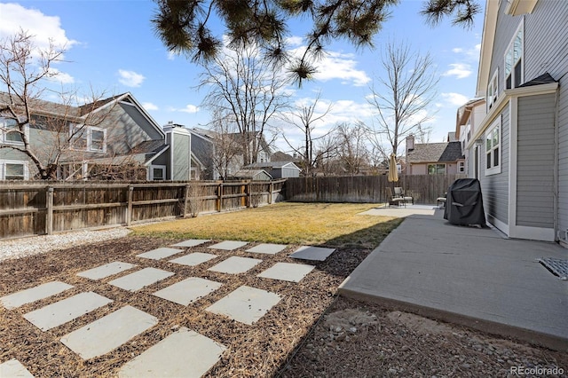 view of yard with a residential view, a fenced backyard, and a patio area