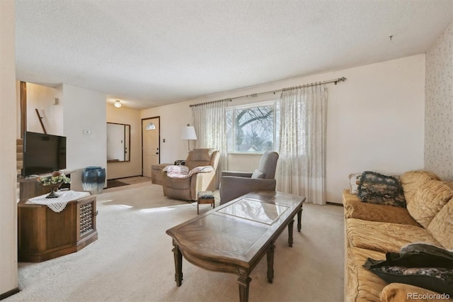 living room with light colored carpet and a textured ceiling