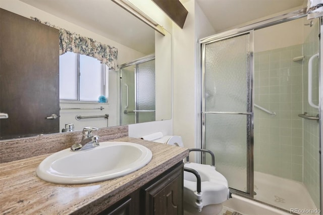 bathroom featuring a stall shower and vanity