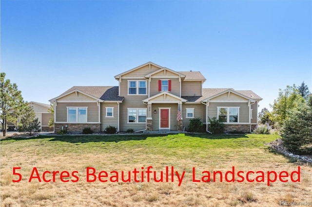 craftsman-style home featuring a front lawn