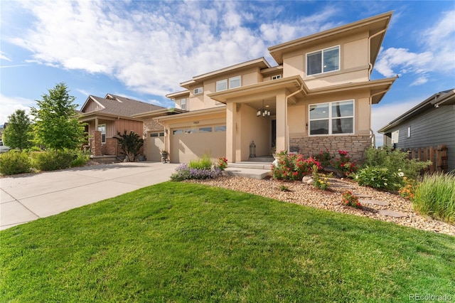 19429 W 88th Dr, Arvada, CO 80007 - prairie-style home with stucco siding, a garage, driveway, a front yard, and stone siding