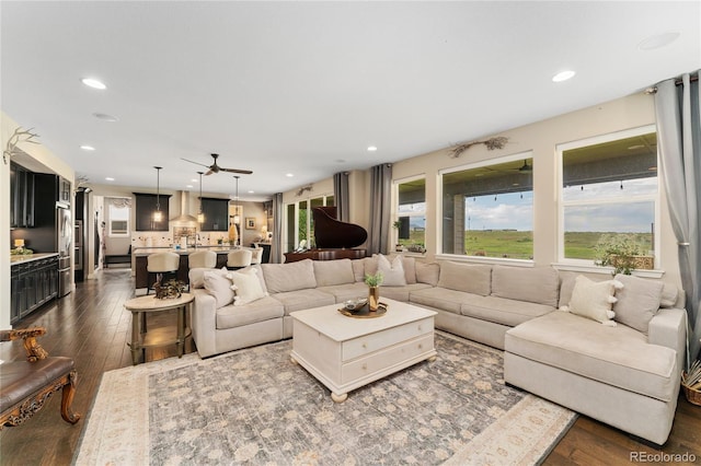 19429 W 88th Dr, Arvada, CO 80007 - living room with dark wood-style flooring, recessed lighting, and ceiling fan