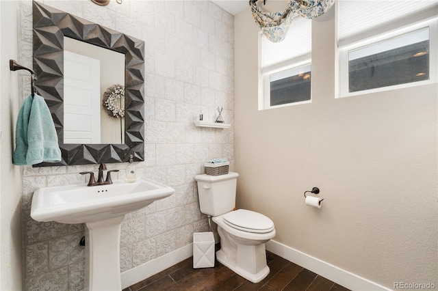 19429 W 88th Dr, Arvada, CO 80007 - half bathroom with wood finished floors and tile walls