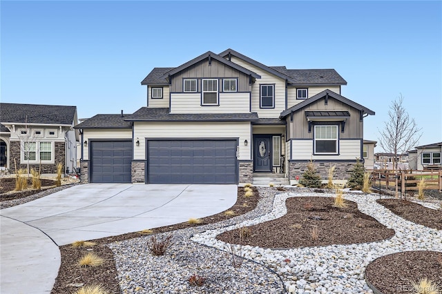 craftsman-style house featuring stone siding, fence, board and batten siding, and concrete driveway