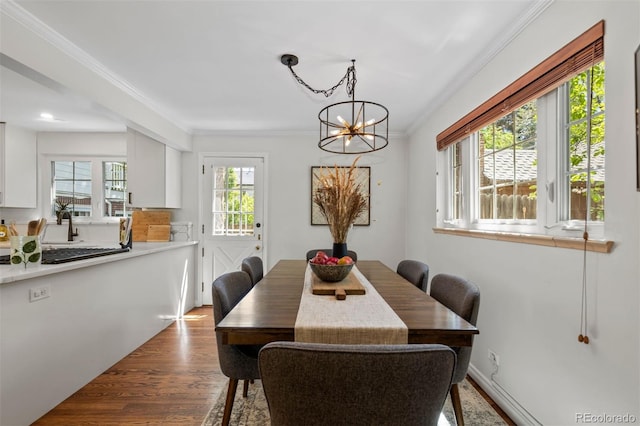 400 Holly St, Denver, CO 80220 - dining room with a chandelier, crown molding, dark wood finished floors, and recessed lighting