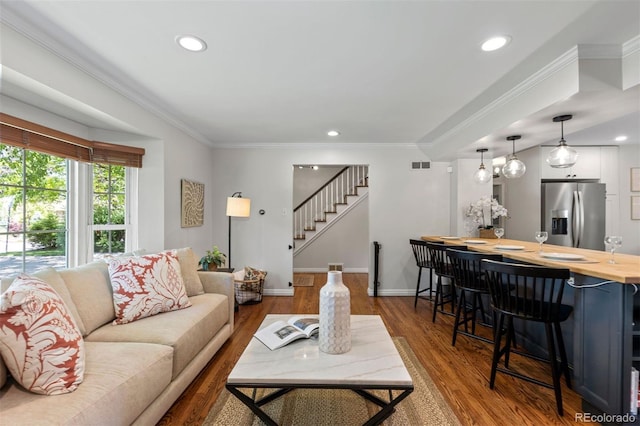 400 Holly St, Denver, CO 80220 - living room with stairs, wood finished floors, ornamental molding, baseboards, and recessed lighting