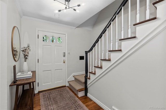 400 Holly St, Denver, CO 80220 - foyer entrance with wood finished floors, baseboards, stairs, a chandelier, and ornamental molding