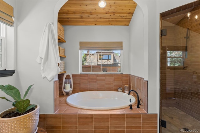 400 Holly St, Denver, CO 80220 - full bathroom featuring a stall shower, a bath, and lofted ceiling