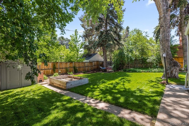 400 Holly St, Denver, CO 80220 - view of yard featuring a garden