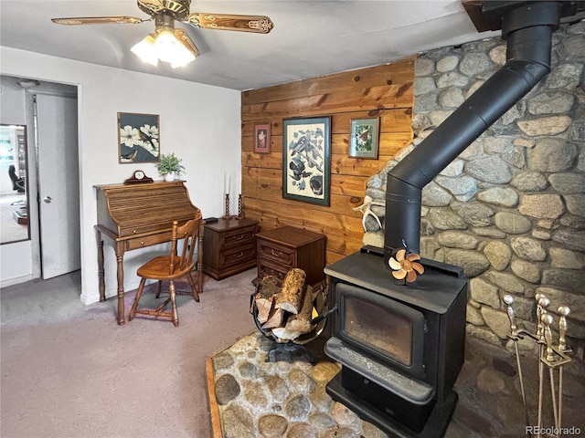 16670 County Road 126, Pine, CO 80470 - living area featuring a wood stove, wooden walls, and ceiling fan