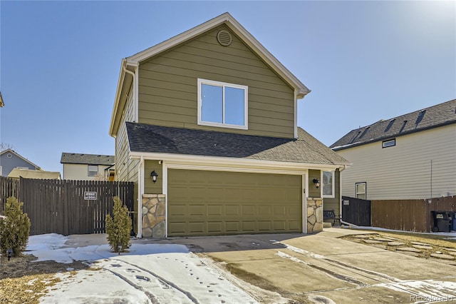 front of property with a garage