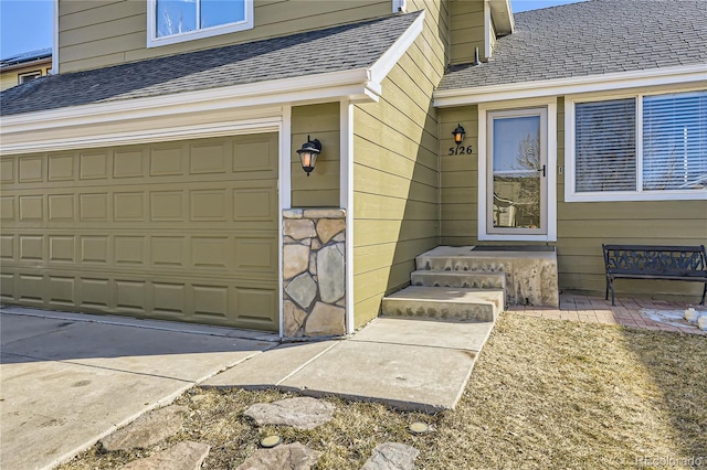 view of exterior entry featuring a garage