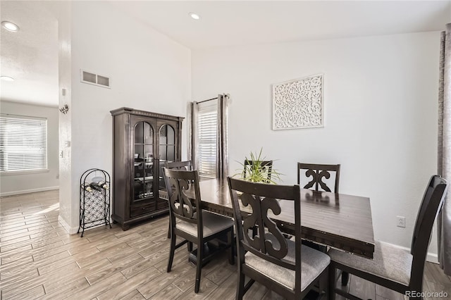 dining room with light hardwood / wood-style flooring