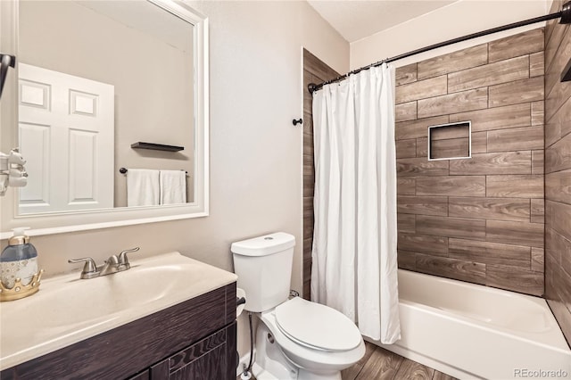 full bathroom featuring vanity, shower / tub combo, hardwood / wood-style flooring, and toilet