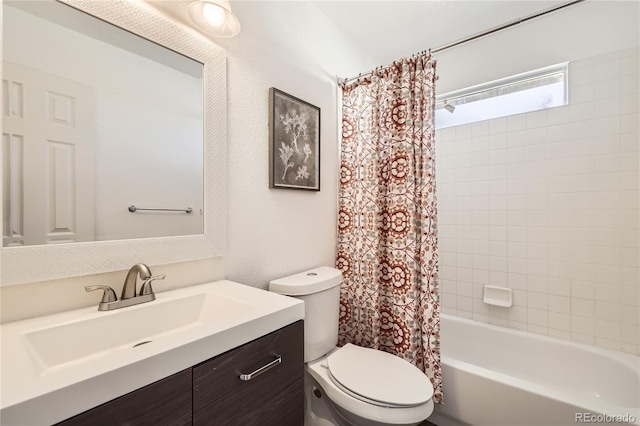 full bathroom featuring vanity, toilet, and shower / bath combo with shower curtain