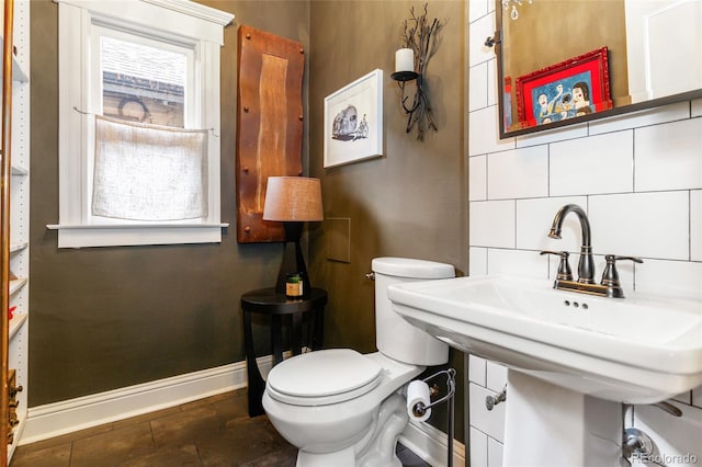 3701 Eliot St, Denver, CO 80211 - bathroom with toilet and decorative backsplash