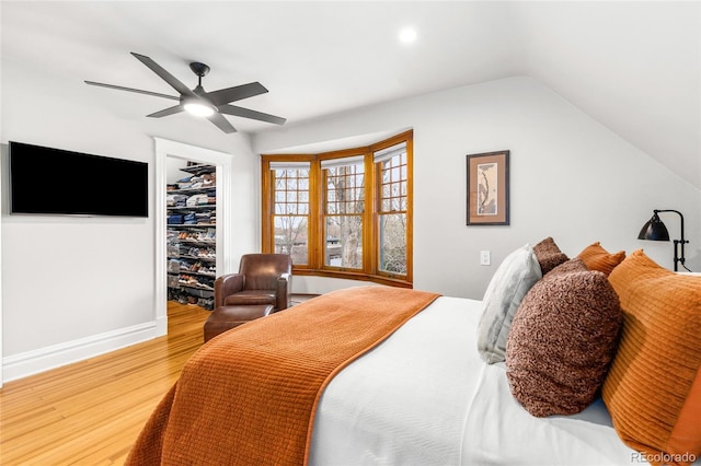 3701 Eliot St, Denver, CO 80211 - bedroom with wood finished floors, vaulted ceiling, a ceiling fan, a spacious closet, and a closet