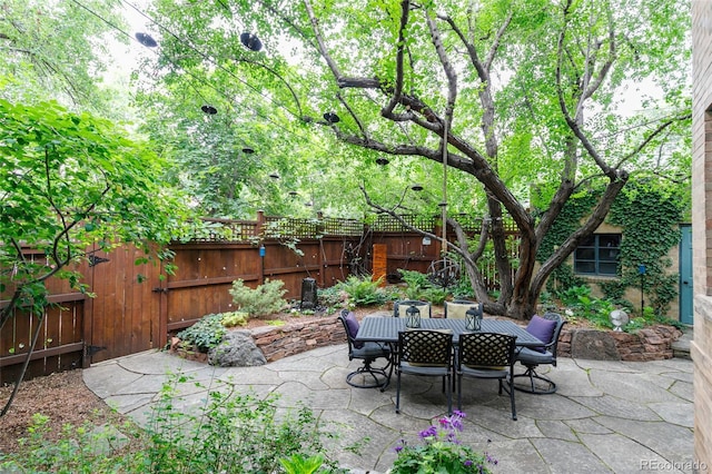 3701 Eliot St, Denver, CO 80211 - fenced backyard featuring a patio and outdoor dining space