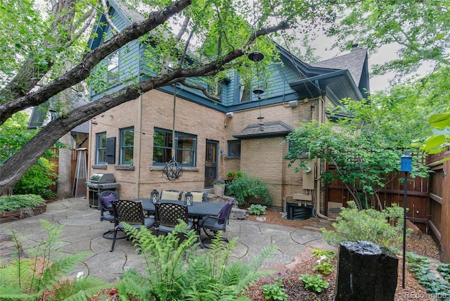 3701 Eliot St, Denver, CO 80211 - back of property with brick siding and a patio