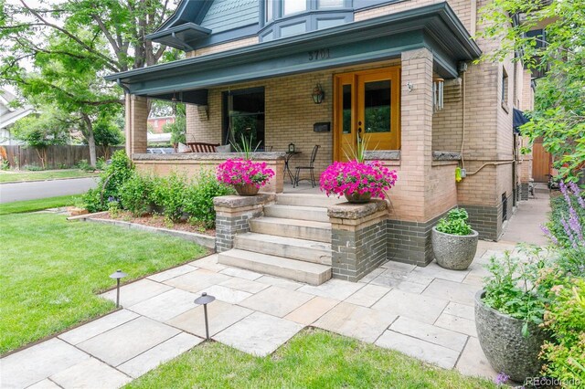 3701 Eliot St, Denver, CO 80211 - entrance to property featuring a porch and brick siding
