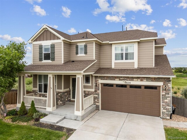 3620 Sandoval St, Brighton, CO 80601 - view of front facade with covered porch, stone siding, concrete driveway, and roof with shingles