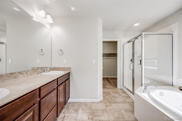 3620 Sandoval St, Brighton, CO 80601 - full bath featuring a shower stall, double vanity, a garden tub, and a spacious closet