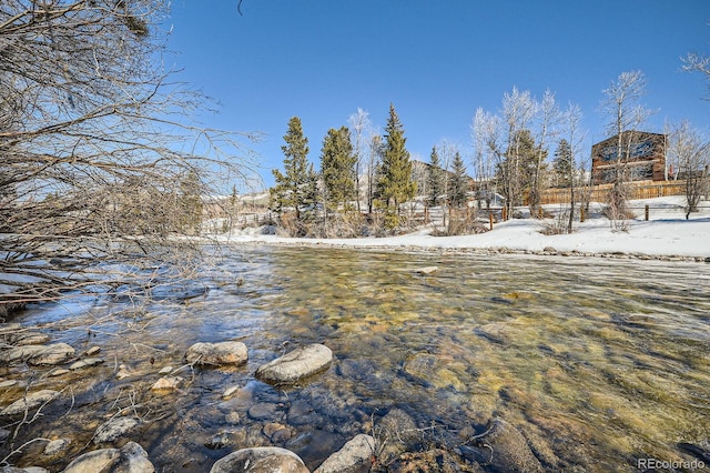 846 Blue River Pkwy Unit C2, Silverthorne, CO 80498 - snowy yard featuring fence