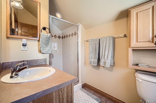 846 Blue River Pkwy Unit C2, Silverthorne, CO 80498 - full bathroom with baseboards, a sink, toilet, and a shower stall