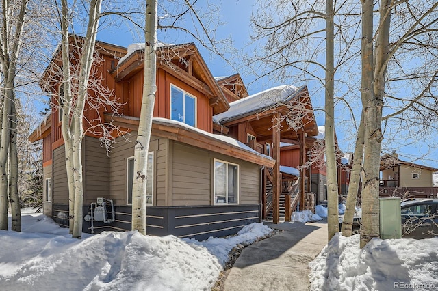 846 Blue River Pkwy Unit C2, Silverthorne, CO 80498 - view of snowy exterior featuring stairway